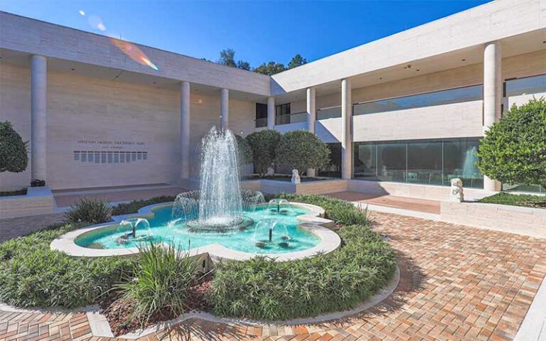 exterior courtyard with fountain and sculptures at appleton museum of art ocala