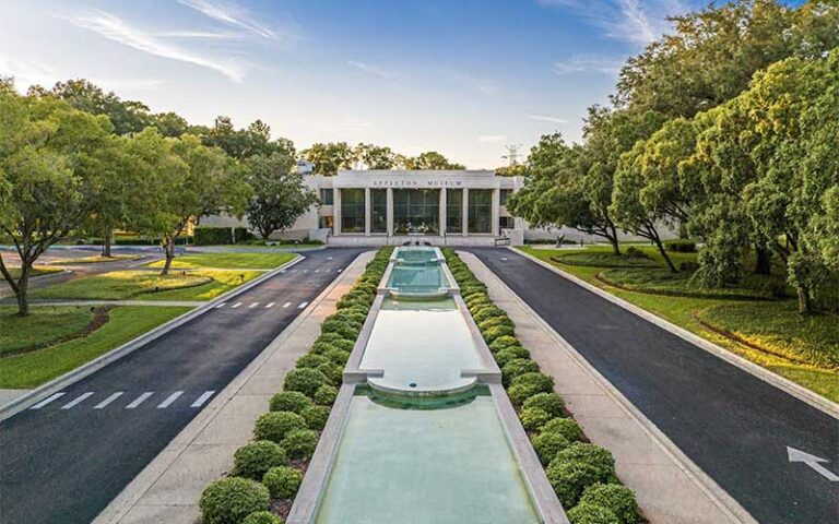 front exterior of museum with reflecting pool and elephant sculptures at appleton museum of art ocala