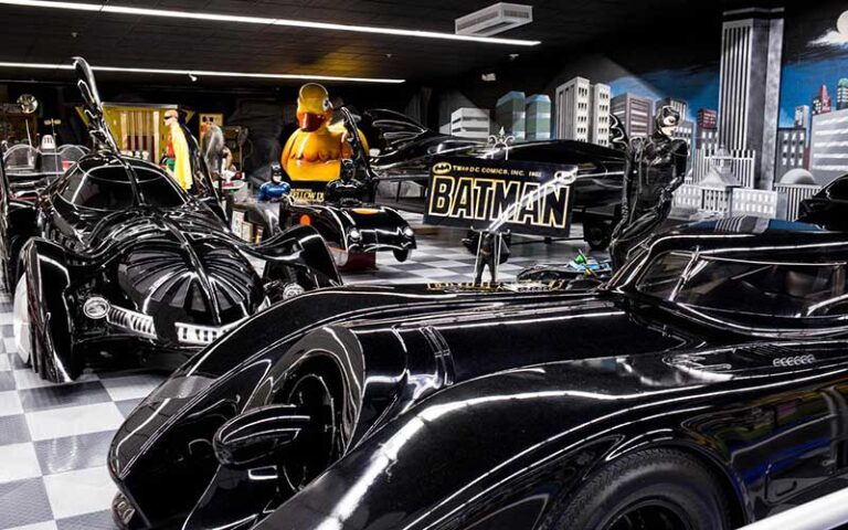 batmobiles on display with signs at tallahassee automobile museum