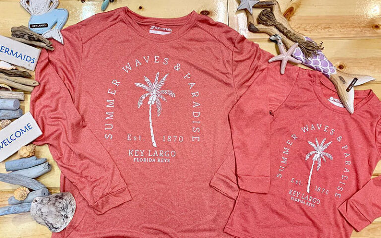 adult and kids t shirts with shells on shelf at largo cargo co florida keys