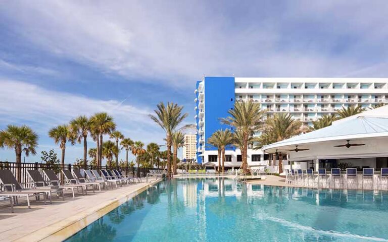 pool area with ocean view and hotel at hilton clearwater beach resort