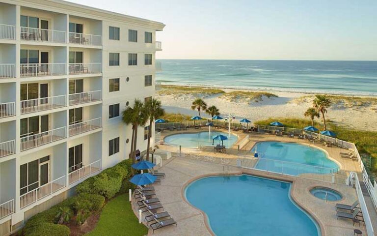 aerial of three pool deck with hotel and beach at springhill suites pensacola beach