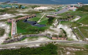 aerial view of fortress ruins with beach and visitor center at fort pickens pensacola