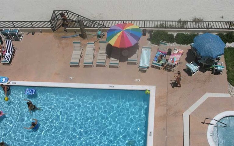 aerial view looking down on pool deck with beach access at tropic shores resort daytona beach