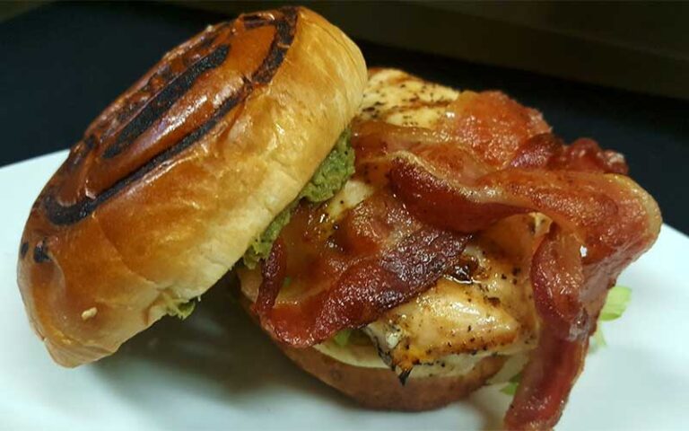 bacon burger with branded bun at ovation bistro bar winter haven