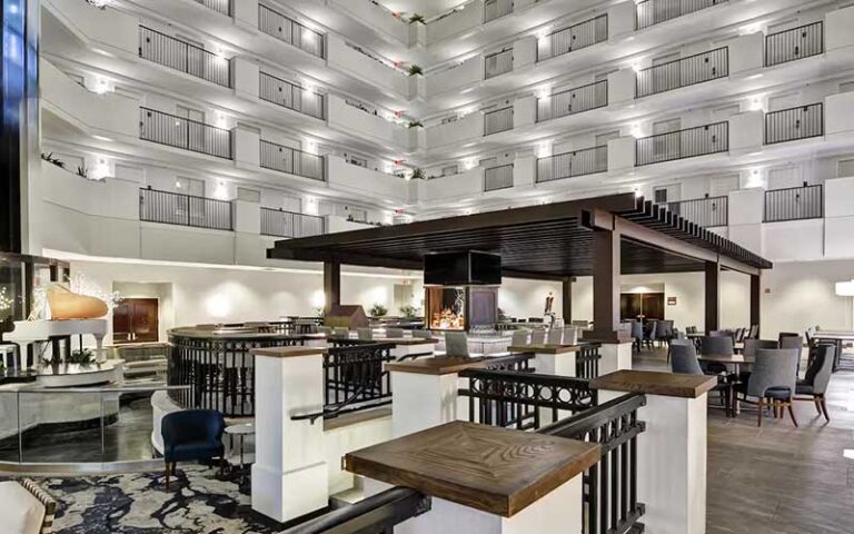 bar and dining area in atrium with hotel room levels at embassy suites orlando downtown