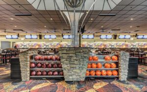 bowling lanes with seating and ball racks at incredibowl entertainment winter haven