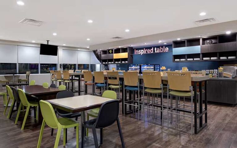 breakfast cafe seating area at home2 suites by hilton orlando international drive south