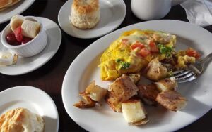 breakfast entree with sides on tabletop at adams egg daytona beach