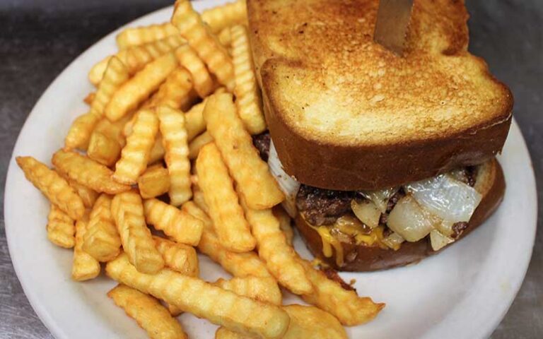 burger on texas toast with fries at cozy oaks restaurant lakeland