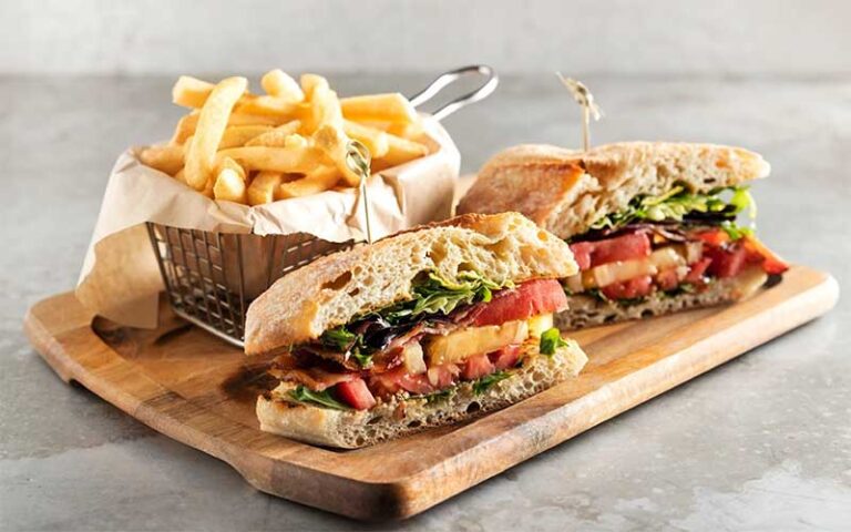 club sandwich with fries on board at grillsmith lakeland
