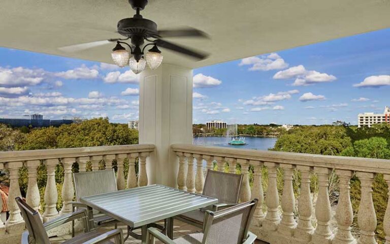 corner balcony with ceiling fan and view of lake eola at embassy suites orlando downtown