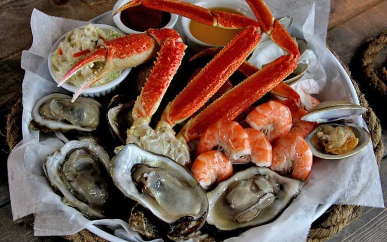 crab legs oysters shrimp and slaw platter at ocean deck restaurant bar daytona beach