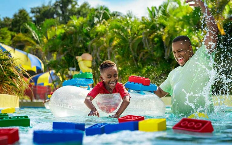 dad and kid playing in lazy river at legoland florida water park winter haven