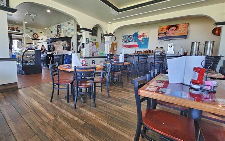 dining room interior with wood floors and archways at steves famous diner daytona beach