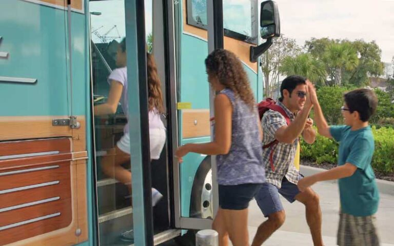 family getting into bus shuttle at universals endless summer resort dockside inn suites orlando