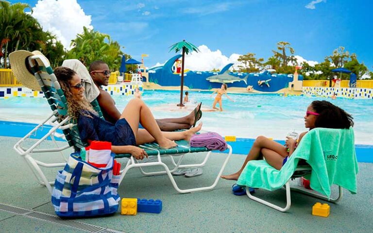 family lounging by wave pool at legoland florida water park winter haven