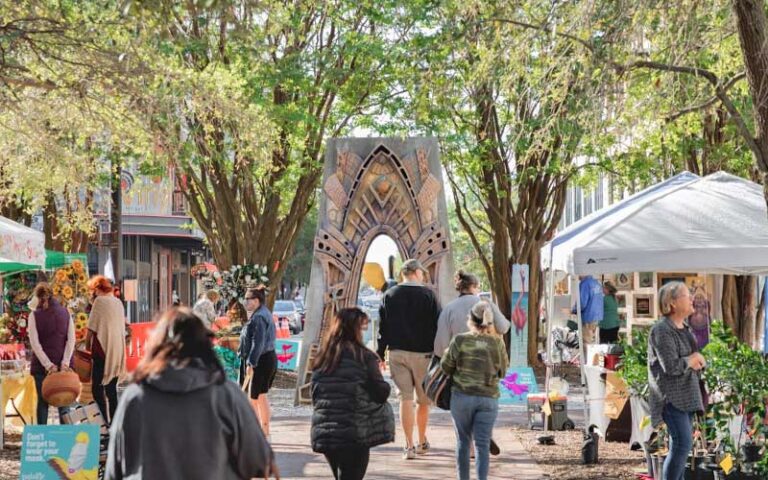 farmers market stalls with archway sculpture at palafox market pensacola