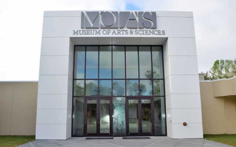 front entrance of building with sign at museum of arts sciences daytona beach