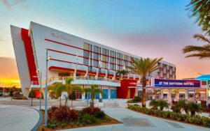 hotel exterior with sunset at the daytona autograph collection hotel