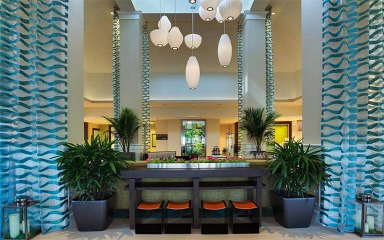 hotel lobby with chic drapes and lighting at hilton garden inn daytona beach oceanfront
