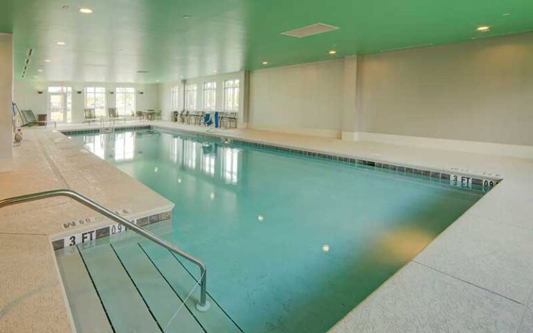 indoor pool with green ceiling at hyatt place pensacola airport