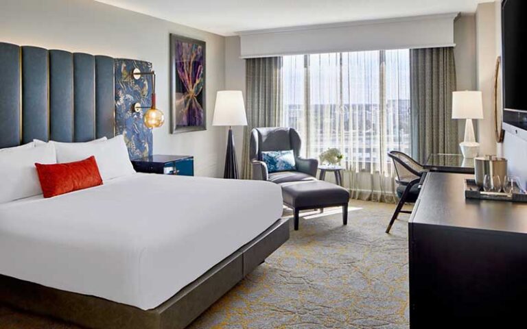 king bed guestroom with view at grand bohemian hotel orlando