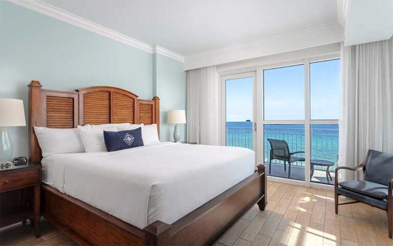 king size bed suite with balcony gulf view at the pensacola beach resort