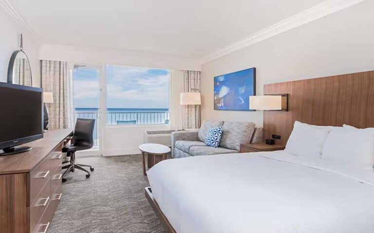king size bed suite with gulf view balcony at hilton pensacola beach