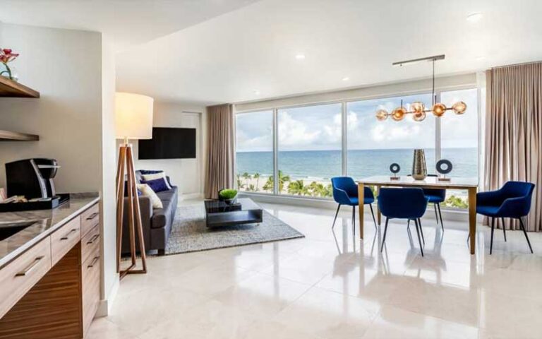 living room area suite with windows at b ocean resort fort lauderdale