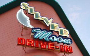 neon sign on corner of brick building at silver moon drive in theatre lakeland
