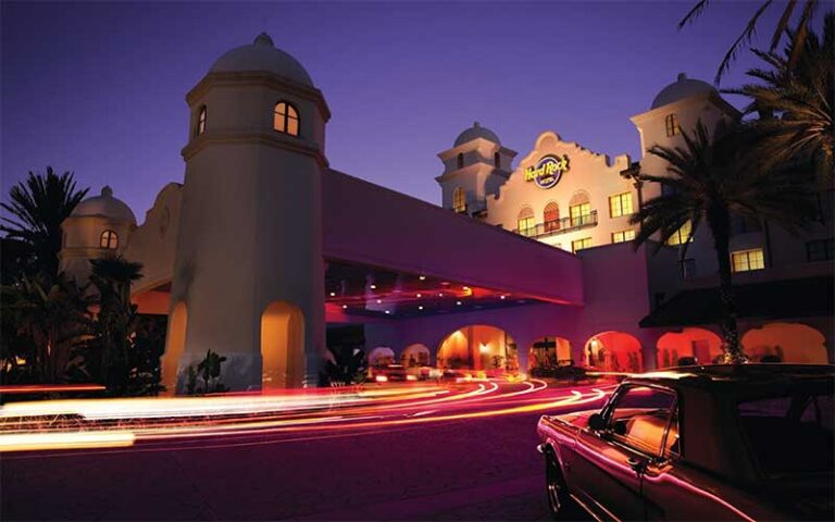 night exterior of hotel drive up with classic car at hard rock hotel at universal orlando