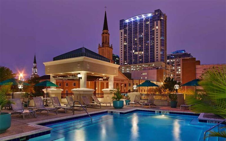 night view of pool with downtown skyline at embassy suites orlando downtown