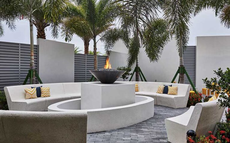 outdoor patio with fire pit at the daytona autograph collection hotel