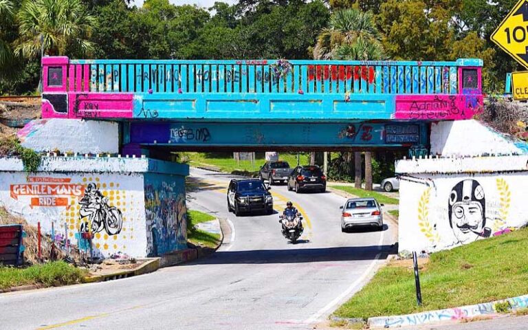 painted underpass with cars passing at graffiti bridge pensacola