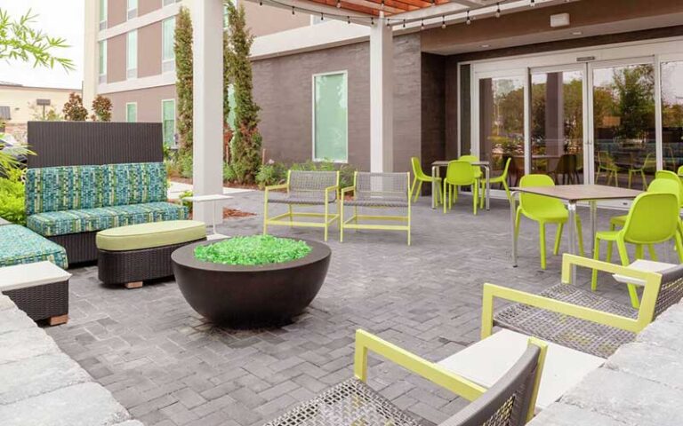 patio with outdoor seating at home2 suites by hilton orlando south park