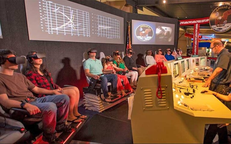 people seated with vr gear on apollo simulator at national naval aviation museum pensacola