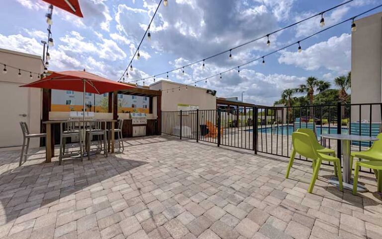 pool deck and patio at home2 suites by hilton orlando international drive south