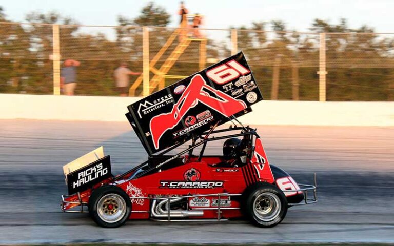 red sprint car speeding on track at auburndale speedway winter haven