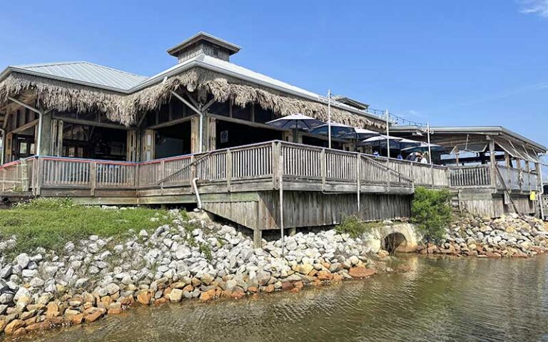 restaurant view from water with patio seating at the oar house pensacola