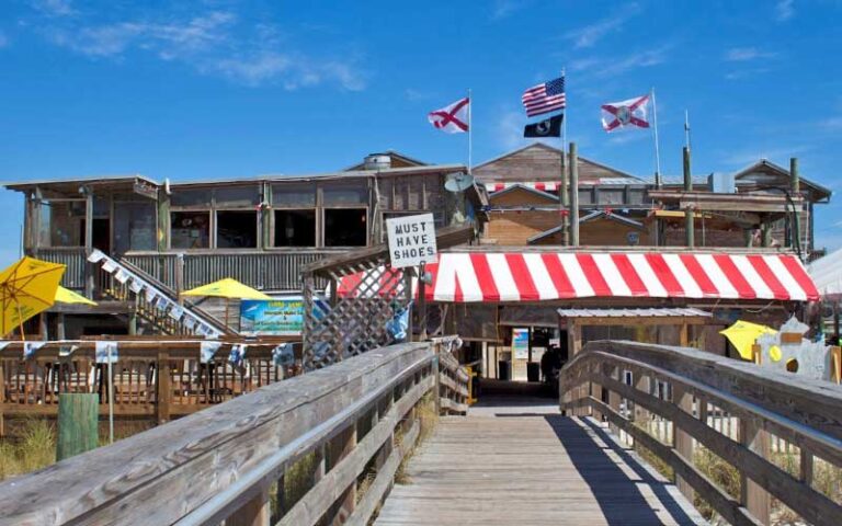 road house restaurant with boardwalk to beach at flora bama pensacola