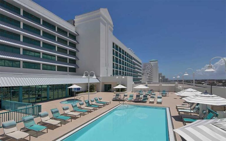 rooftop pool deck with loungers at hotel at hilton daytona beach oceanfront resort