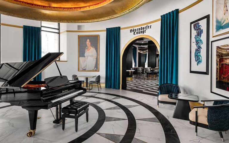 rotunda room with piano and restaurant entrance at grand bohemian hotel orlando