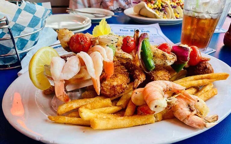 shrimp entree with sides on dining table at flounders chowder house pensacola beach