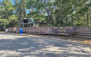 sign and pavilion with boardwalks at bay bluffs park pensacola