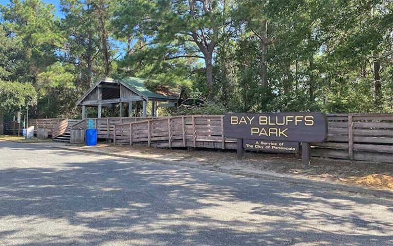 sign and pavilion with boardwalks at bay bluffs park pensacola