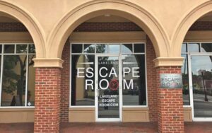 store front with arched awning and sign at lakeland escape room