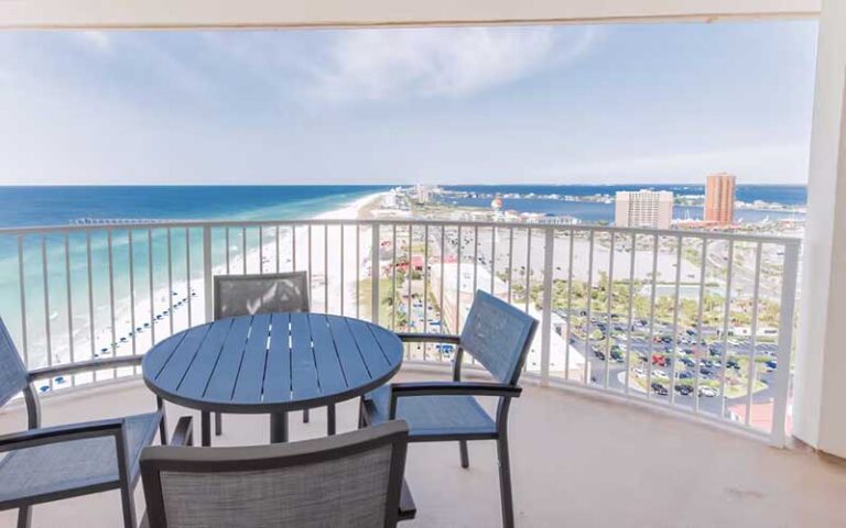 terrace balcony view of coastline with table and chairs at hilton pensacola beach
