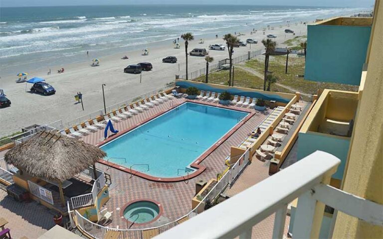 view from balcony of pool deck and beach at fountain beach resort daytona
