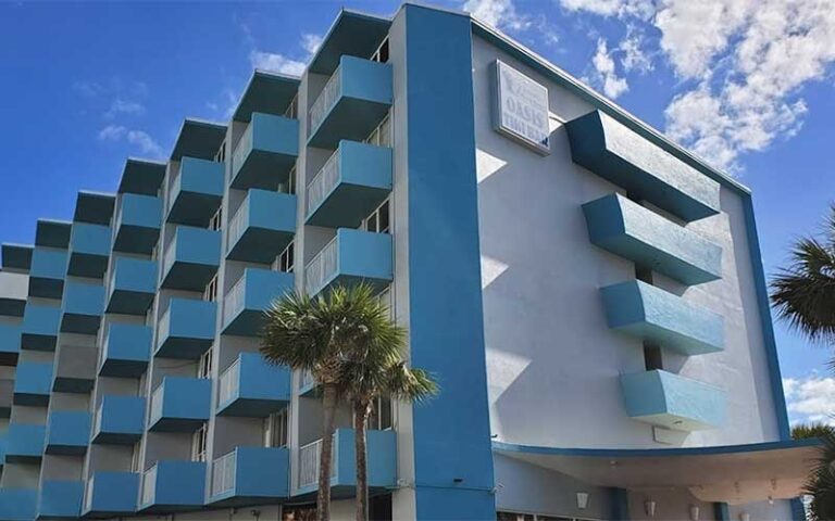 view looking up at hotel with balconies at fountain beach resort daytona